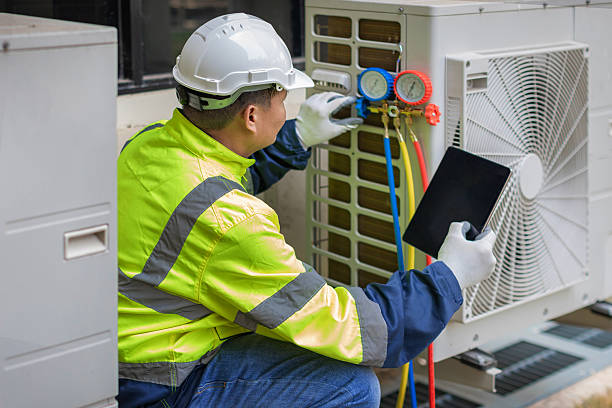Professional Ac Installation technician working in Grain Valley, MO